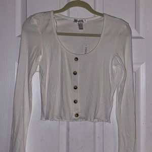 White long sleeve top with buttons down middle